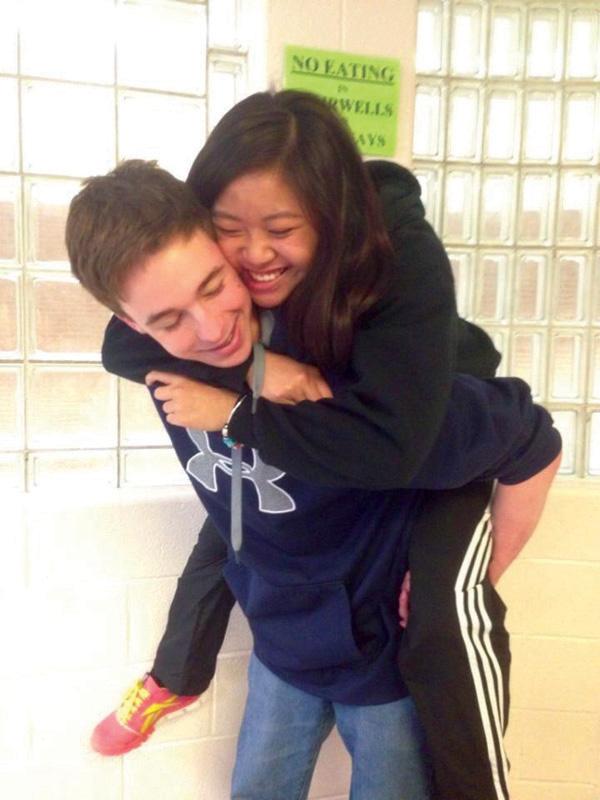 Junior Matt McNeil gives girlfriend Julie Dang a piggyback ride to class.