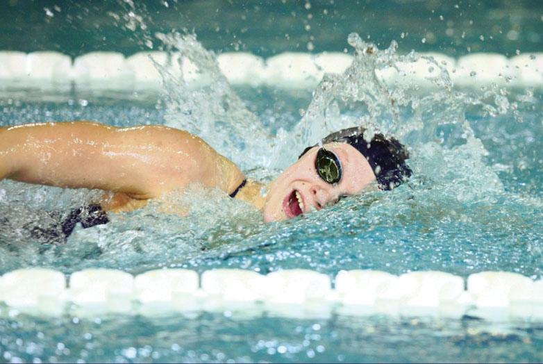Sophomore Catherine “Caytie” Johnson speeds past other competitors in the pool in Springbrook’s against Watkins Mill High School at Olney Swim Center; the girls lost a tough meet 75-95.