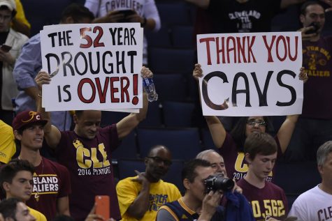 Cavalier fans hold signs after the Cleveland Cavaliers defeated the Golden State Warriors in Game 7 of the NBA Finals on Sunday, June 19, 2016, at Oracle Arena in Oakland, Calif. (Jose Carlos Fajardo/Bay Area News Group/TNS)