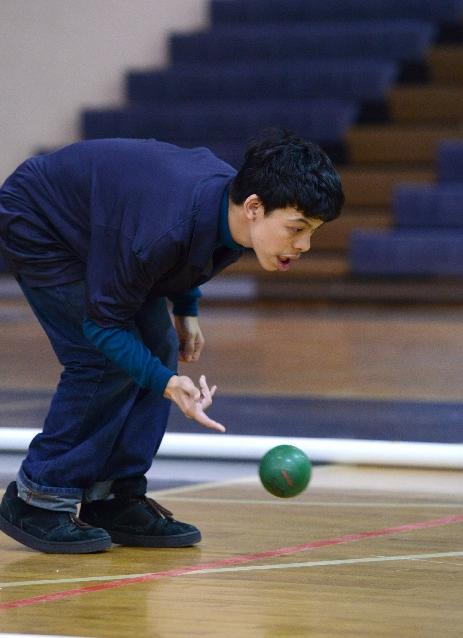 Simone Lowenstein uses laser focus to roll his  bocce ball.