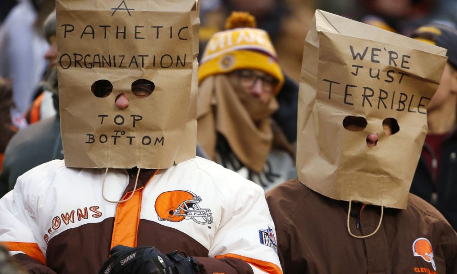 Cleveland Browns fans wear bags on their heads during an NFL football game against the Pittsburgh Steelers in Cleveland, Ohio Sunday, Jan. 3, 2016. (Winslow Townson/AP Images for Panini)