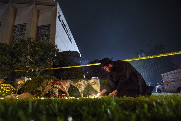 Rabbi Eli Wilansky lights a candle after a mass shooting at Tree of Life Synagogue in Pittsburghs Squirrel Hill neighborhood on Saturday. 