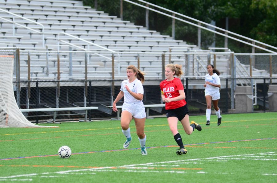 Ashley Tock of the Girls Varsity Soccer team sprints down the line. 