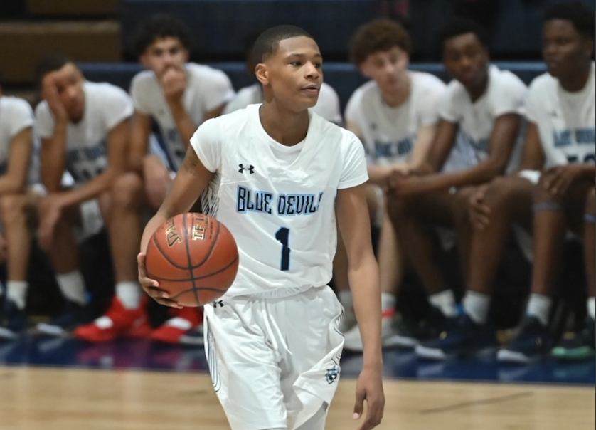 Amare Curtis (#1) runs point during a 2020 Varsity game. 