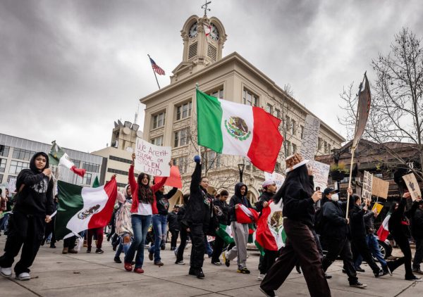 Hundreds of protesters march on the streets surrounding  Courthouse Square in Santa Rosa to protest the Trump administration’s immigrant policies on a national Day without Immigrants Mon., Feb. 3, 2025.  (John Burgess / The Press Democrat)